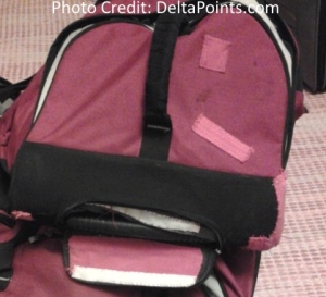 a close-up of a pink and black bag