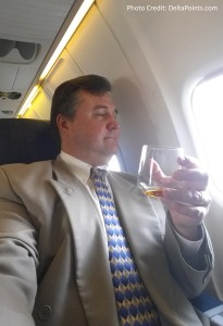 a man holding a glass of alcohol