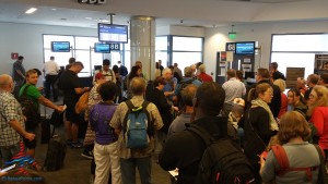 mass of people boarding delta flight LAX airport