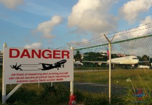 danger jets taking off sign sxm maho beach renespoints blog