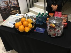 a table with fruit and water bottles