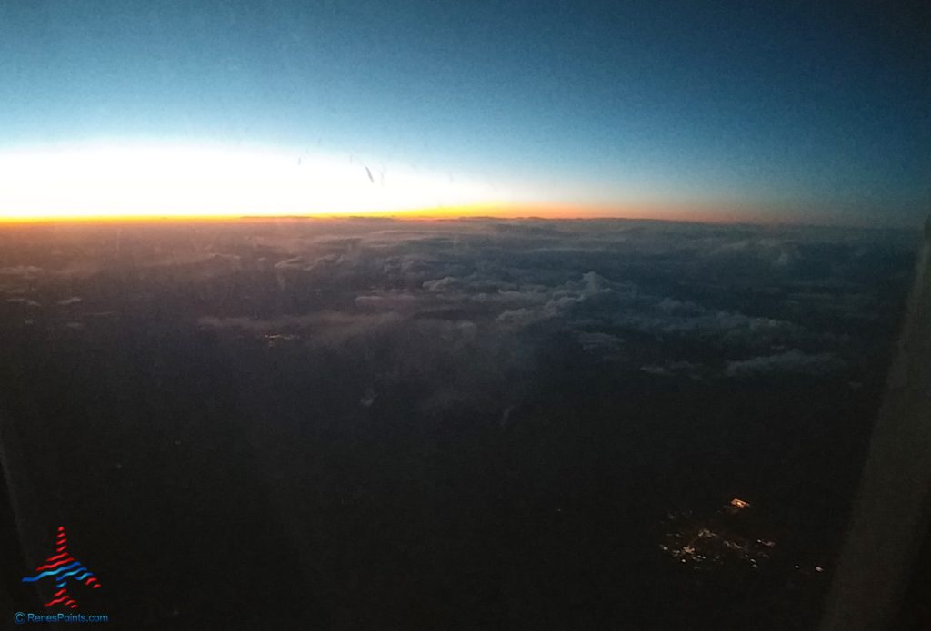 sunset from a delta jet clouds renespoints