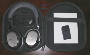 a black case with headphones and a card