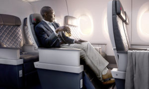 a man sitting in a chair on an airplane