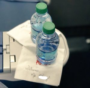 a couple of bottles of water on a napkin