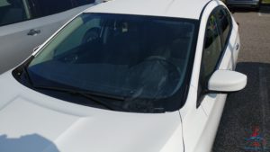 a white car with a windshield
