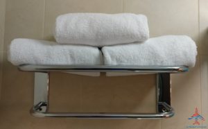 a stack of towels on a towel rack