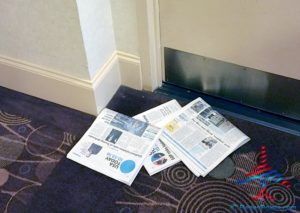 a pile of newspapers on the floor