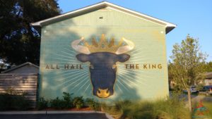 a building with a cow head and crown on it