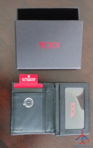 a black wallet with a red tag