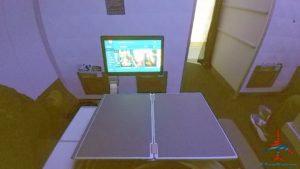 a table with a computer monitor