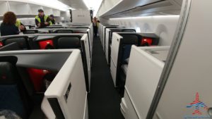 a row of white chairs on a plane