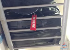 a luggage bag on a metal rack