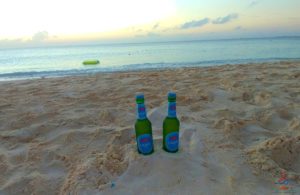 two bottles in the sand