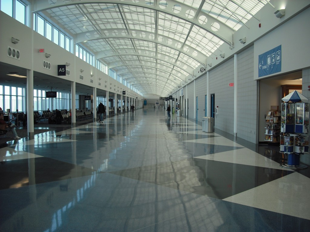 a long hallway with people walking in the middle
