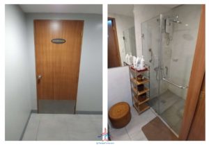 a bathroom with a shower and a door