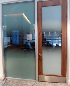 a glass door with a wooden frame