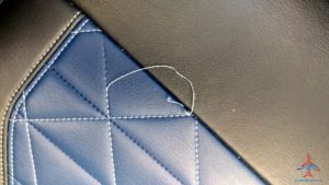 a thread on a leather surface