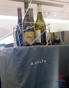 a group of bottles of wine on a metal rack