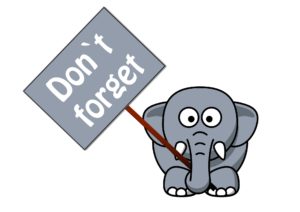 a cartoon elephant holding a sign