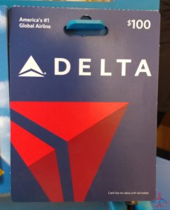 a blue gift card with a red triangle and white text