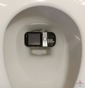 a cell phone in a toilet