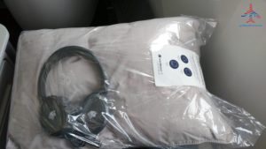 a pillow and headphones in a plastic bag