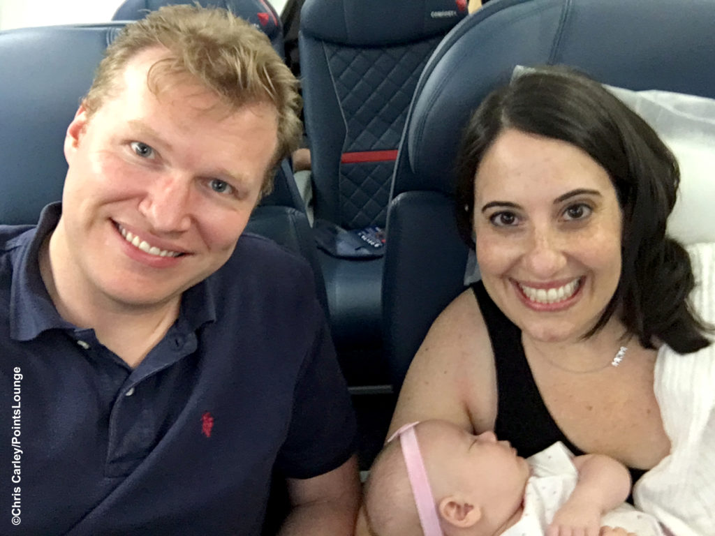 Father, mother, and infant sitting in Delta first class: the fabulous flying Carleys!