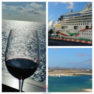 a wine glass next to a cruise ship