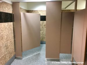 Men's restroom bathroom stalls are seen at The CLUB at SJC airport lounge at Norman Y. Mineta San Jose International Airport in San Jose, California.
