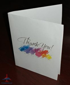 a white card with a thank you message