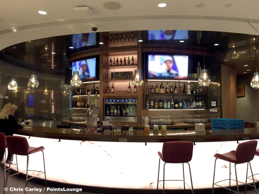 The bar and liquor bottles are seen at the Delta Sky Club Austin airport lounge at Austin-Bergstrom International Airport (AUS) in Austin, Texas. Photo © Chris Carley / PointsLounge