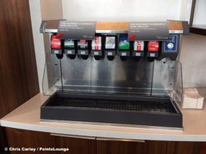 A broken Coca-Cola soda pop fountain machine is seen inside the Delta Sky Club Austin airport lounge at Austin-Bergstrom International Airport (AUS) in Austin, Texas. Photo © Chris Carley / PointsLounge