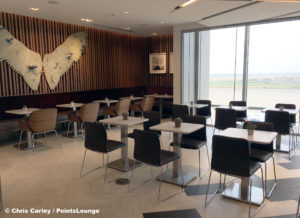 Dining room tables and chairs are seen at the Delta Sky Club Austin airport lounge in Austin, Texas. Photo © Chris Carley / PointsLounge
