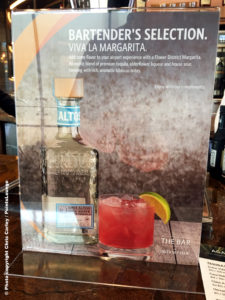 A placard advertising the Flower District Margarita is seen inside the Delta Sky Club Austin airport lounge at Austin-Bergstrom International Airport (AUS) in Austin, Texas. Photo © Chris Carley / PointsLounge