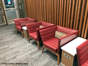 Red seats are seen inside the Delta Sky Club Austin airport lounge at Austin-Bergstrom International Airport (AUS) in Austin, Texas. Photo © Chris Carley / PointsLounge