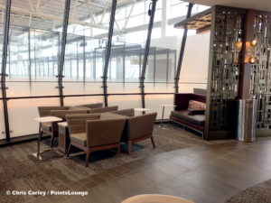 A seating area inside the circular bar portion is seen at the Delta Sky Club Austin airport lounge at Austin-Bergstrom International Airport (AUS) in Austin, Texas. Photo © Chris Carley / PointsLounge