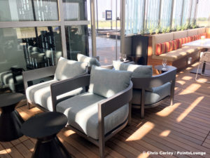 Chaires and tables are seen on the Sky Deck patio of the Delta Sky Club Austin airport lounge in Austin, Texas. Photo © Chris Carley / PointsLounge