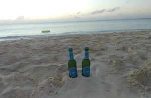two bottles in the sand
