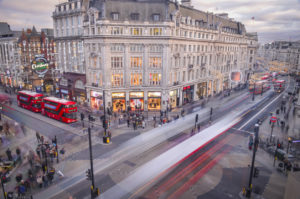 Oxford Circus, an iconic London landmark and famous shopping destination at the crossing of Regent Street and Oxford Street. Long exposure