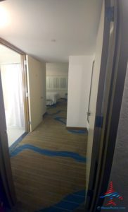 a hallway with a blue carpet