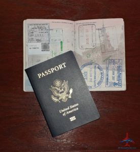 a passport and stamps on a table