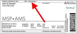 a red arrow pointing to a boarding pass