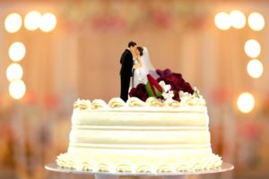 wedding cake bride and groom topper with blur backgroud image