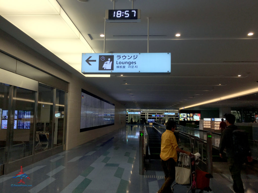 A sign indicates the TIAT Lounge Annex location for Delta One passengers at Tokyo Haneda International Airport in Tokyo, Japan.