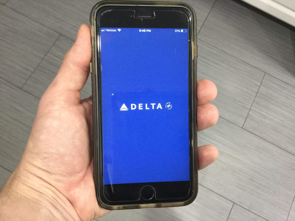 The Fly Delta iOS app displayed on an iPhone.