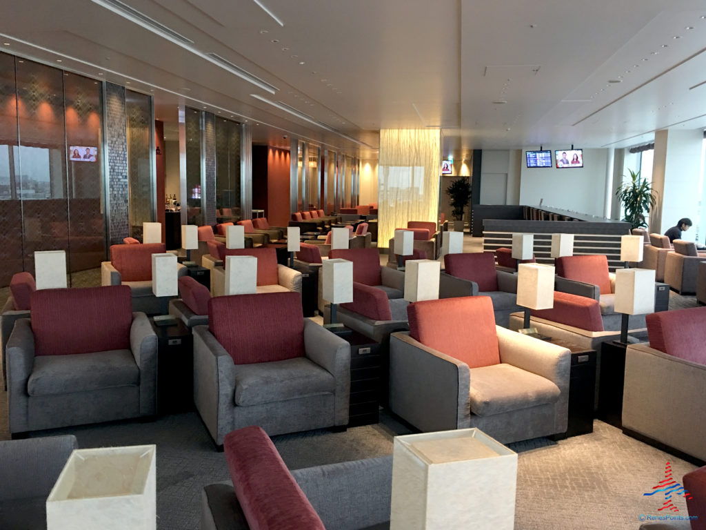 Chairs and tables inside the TIAT Lounge Annex location for Delta One passengers at Tokyo Haneda International Airport in Tokyo, Japan.