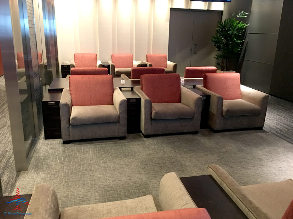 Chairs and tables inside the TIAT Lounge Annex location for Delta One passengers at Tokyo Haneda International Airport in Tokyo, Japan.