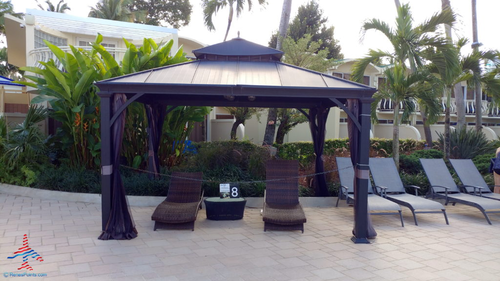 a gazebo with chairs and a table