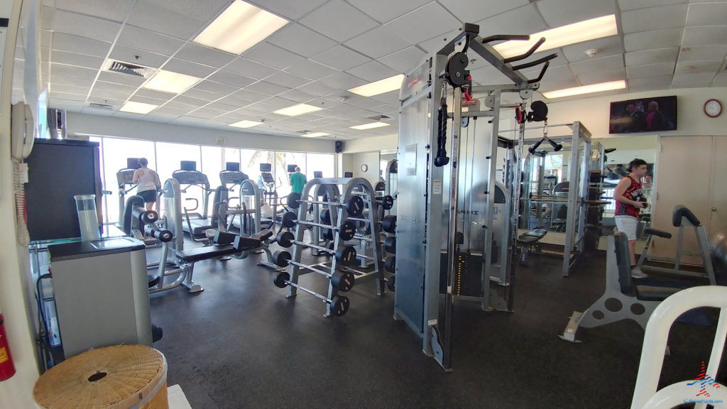 a gym with several equipment
